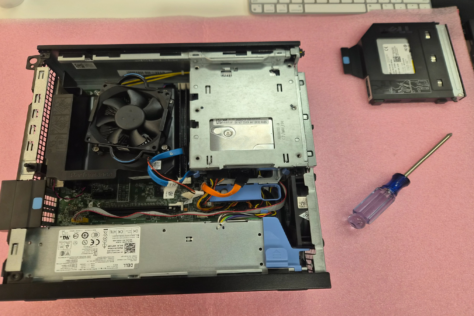 PC opened and taken apart the cover of the case, showing the hardware inside the PC.